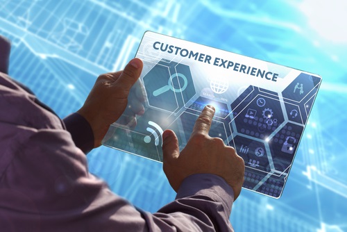 Young business man working on the tablet of the future , select the virtual screen: Customer experience.